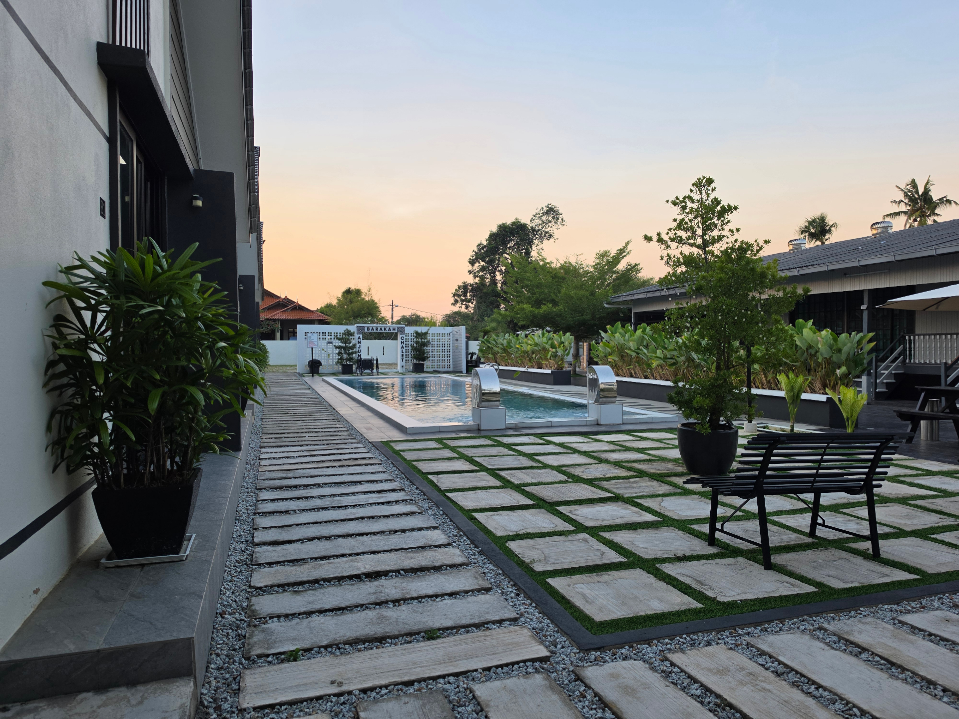 Pool at sunset with pathway